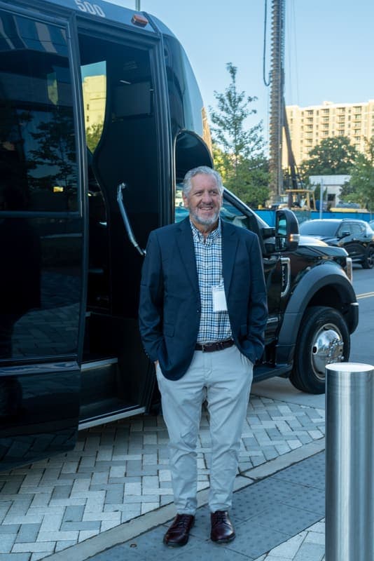 A founder by the bus at The Pearl before leaving Charlotte