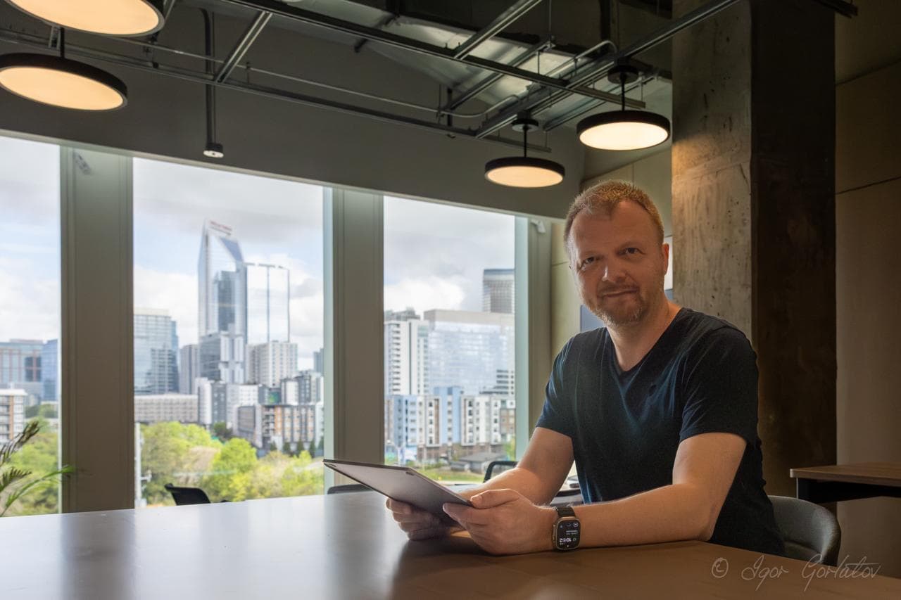 Igor at Connect Labs with the Charlotte skyline behind him