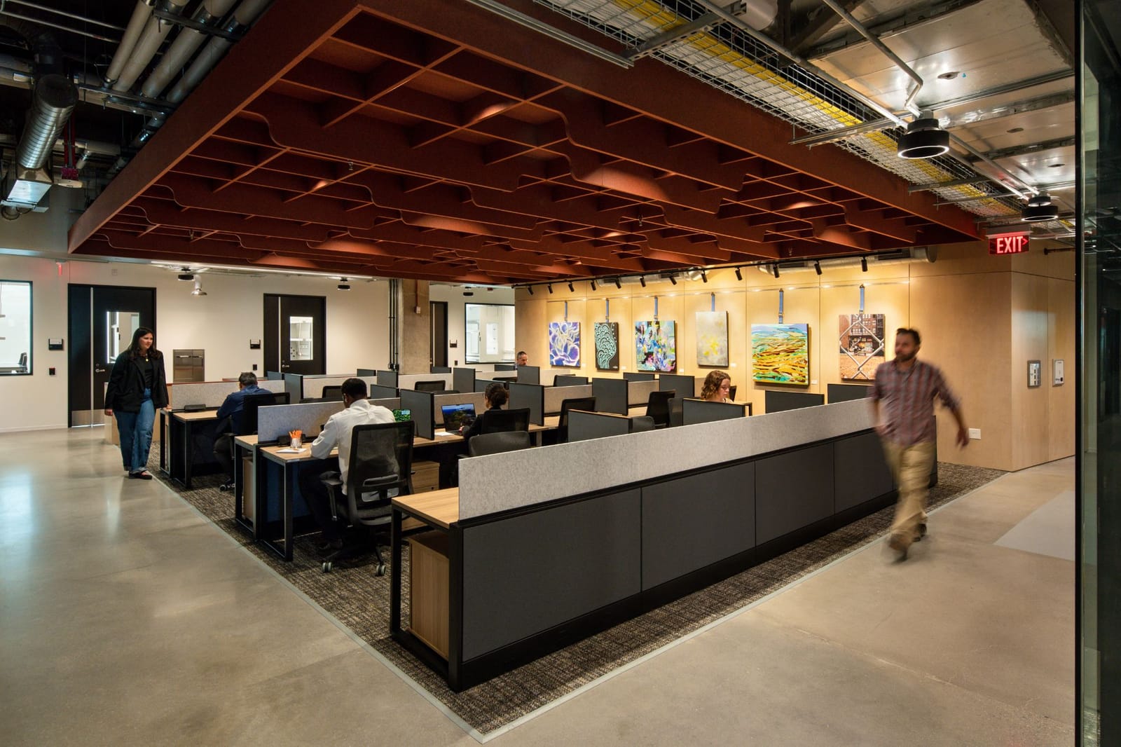 Open desks at Connect Labs Charlotte, with art on the wall